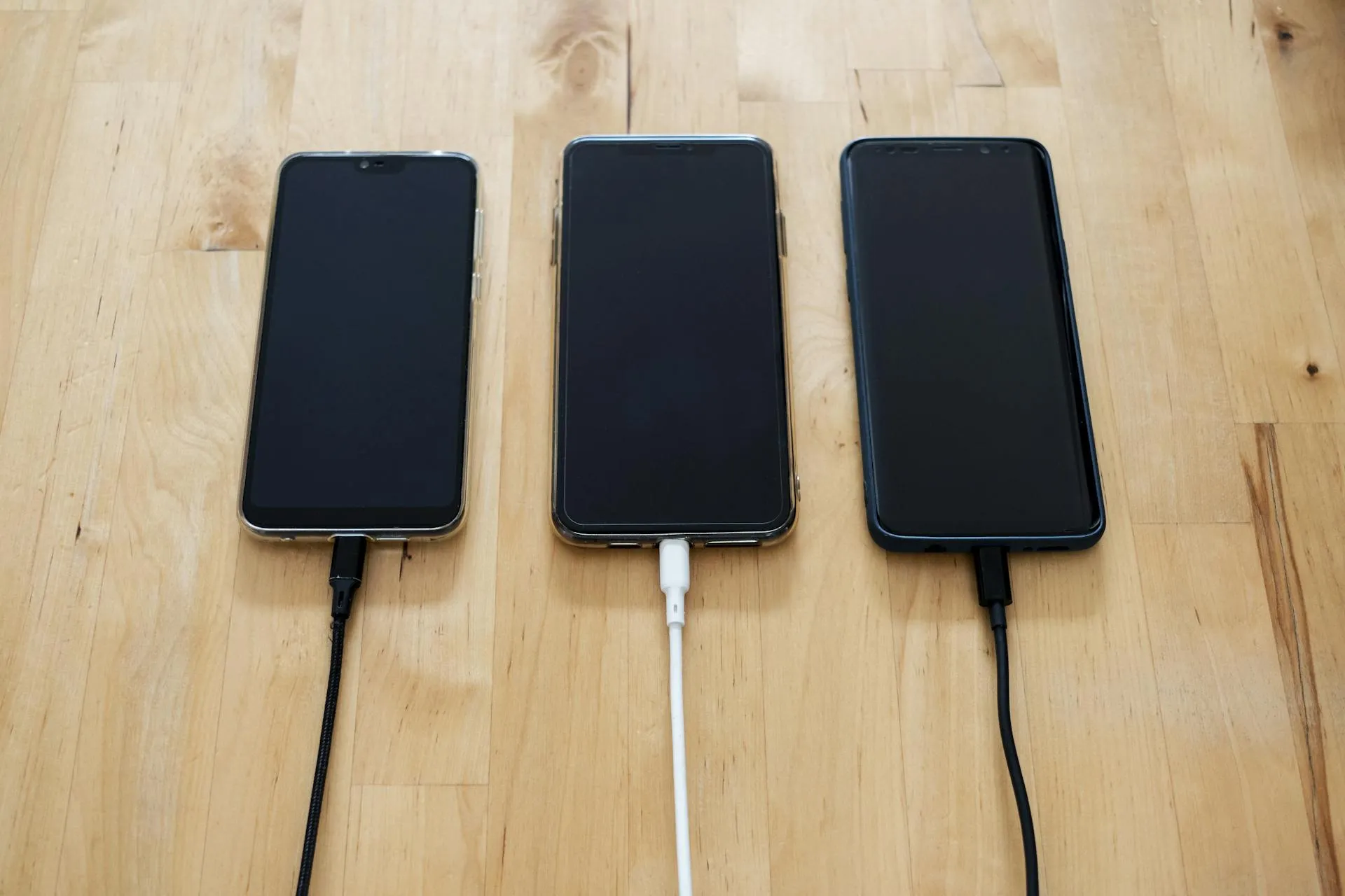 Smartphones being charged